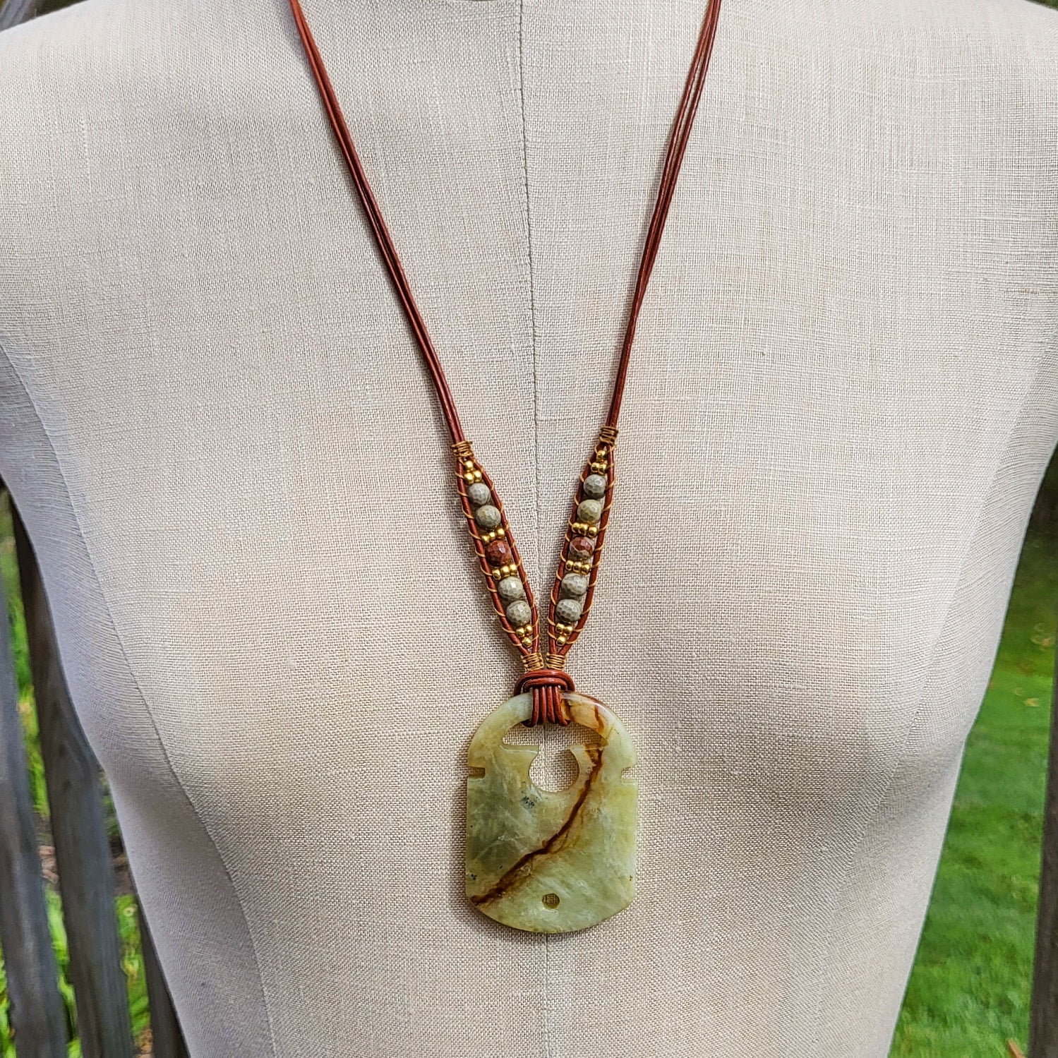 Serpentine store pendent and leather necklace